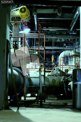 Image of Pipes, tubes, machinery and steam turbine at a power plant