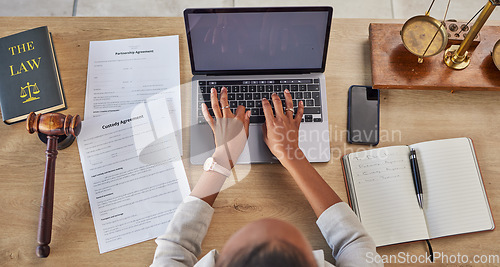 Image of Lawyer, working hands and custody agreement typing with attorney case and notes in a office. Desk, top view and law firm with planning and paperwork for report and family child support document