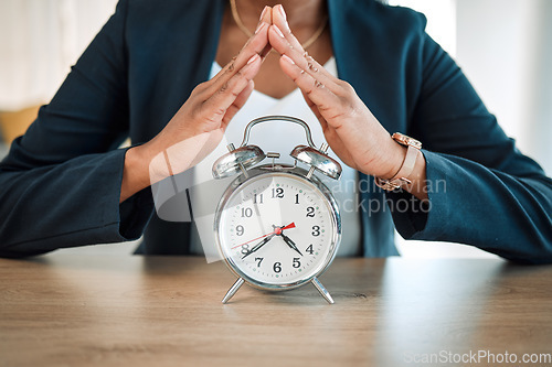 Image of Hands, clock and insurance with a woman broker in her office for life cover or future security. Investment, retirement and hand gesture with a female agent or advisor at work for time management