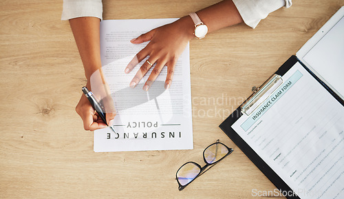 Image of Legal form, hands and person with insurance policy and writing with document and paperwork at law firm. Attorney, claim and contract to sign at a company with top view and information with pen