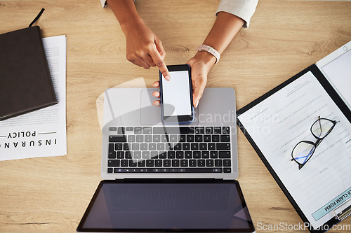 Image of Person hands, blank phone screen and office with mockup space and insurance worker at desk. Mobile app, scroll and top view with web research and business work with data and digital paperwork