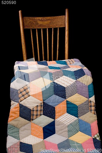 Image of Antique Quilt And Kitchen Chair