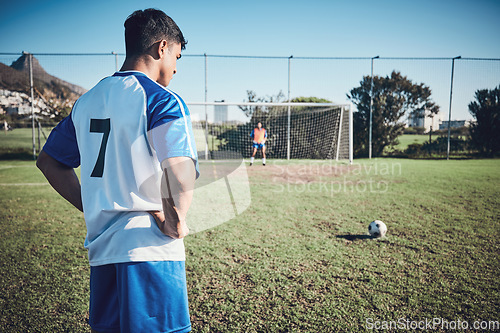 Image of Soccer, thinking and a man on a field for a goal, sports penalty or training for a team. Fitness, focus and an athlete getting ready to kick a football during a competition for cardio, win or playing