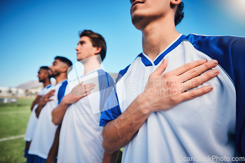 Image of Football team, national anthem and listening at stadium before competition, game or match. Soccer, song and sports players together for pride, collaboration for contest or exercise with hands closeup