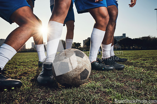 Image of Closeup, ball and soccer with men, game and fitness with sports, competition and workout goals. Zoom, football and athletes with energy, exercise and training for a match, action and tackle challenge