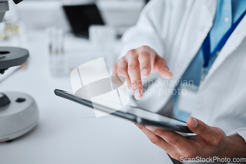 Image of Hospital, doctor and hands with tablet for research, medical innovation and working. Clinic, typing and chemistry analysis with professional and lab worker with tech for laboratory science and data