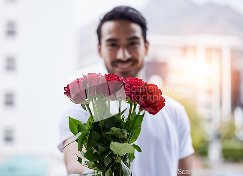 Image of Love, gift and portrait of happy man with roses for date, romance and valentines day. Smile, romantic hope and person giving bouquet of flowers in city, proposal or engagement on blurred background.