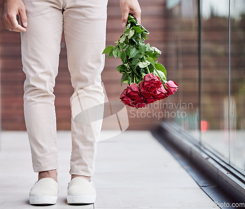 Image of Love, legs and man with bouquet of flowers for date, romance and hope for valentines day. Romantic confession, floral gift and person holding red roses, standing outside for proposal or engagement.