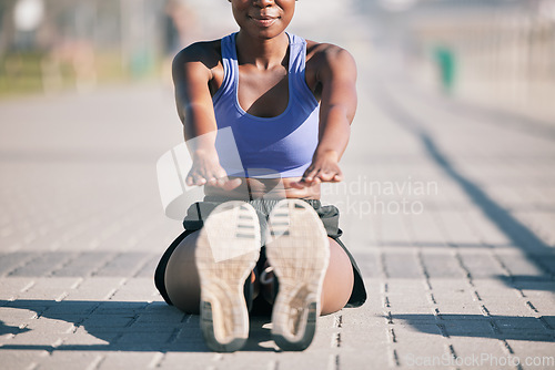 Image of Sports woman, legs and stretching to touch feet for fitness, training and performance on urban ground. Shoes, female athlete and warm up for workout, muscle mobility and flexible exercise of runner