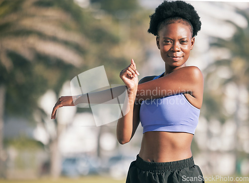 Image of Portrait, exercise and stretching with a black woman runner outdoor for the cardio or endurance training of her body. Fitness, health or running with a young athlete getting ready to workout