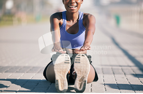 Image of Exercise, happy woman and stretching legs to touch feet for fitness, training or performance on urban ground. Female athlete, smile and warm up for flexible workout, muscle mobility and sports in sun