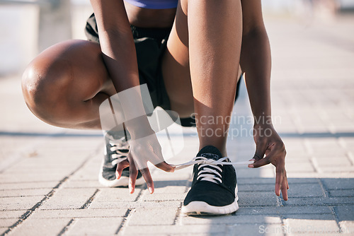 Image of Hands, city and athlete tie shoes to start workout, training and exercise outdoor. Sports, fitness and person tying laces on sneakers to prepare for cardio, running and jog for health and wellness