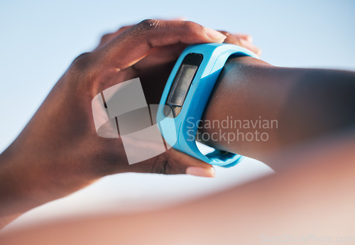 Image of Hands, smart watch and check to monitor for steps, heart rate or speed for running, health or fitness. Person, iot clock and body info on screen with wellness, exercise or training outdoor in closeup