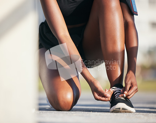 Image of Outdoor, hands and runner tie shoes to start workout, training or exercise. Sports, fitness and athlete tying laces on sneakers to prepare for cardio, running and jog for health or wellness on ground