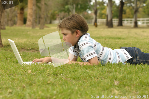 Image of Notebook computer and boy