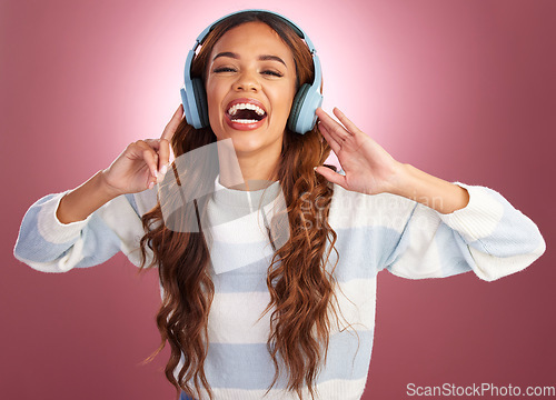 Image of Woman, headphones and music in studio portrait, excited or listen to relax by gradient background. Happy student girl, audio tech and listening for sound, streaming service and online for happiness