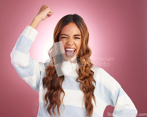 Image of Woman, fist celebration and studio portrait with happiness, winner mindset and smile by gradient background. Girl, model and young with excited face, happy and yes celebrate for winning achievement