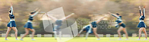 Image of Sports, athlete and woman doing a cheerleading trick on the field while performing a routine. Fitness, blur motion and female cheerleader doing a cart wheel with skill while practicing or training.