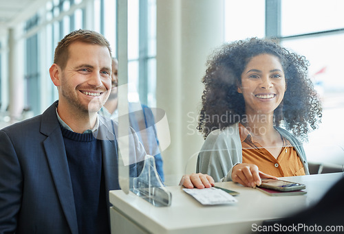 Image of Travel, airport and boarding with business people at a check in counter for an international flight. Documents, passport or ticket with a man and woman traveling for the global growth of a company