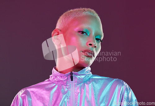 Image of Futuristic fashion, cyberpunk portrait and black woman with chrome clothing in studio. Vaporwave, isolated and gen z with a young female model glow with cosmetics and scifi clothes with mockup