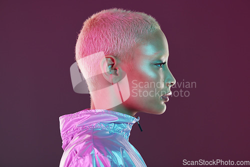 Image of Holographic fashion, woman face and glow for hologram trend isolated on a studio background. Futuristic, vaporwave and art color jacket on cyberpunk model for retro cosmetics and makeup shine on skin