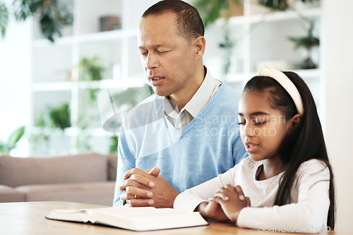 Image of Family, kids and praying with bible books in support, faith or christian worship at home. Father, girl child or prayer of religion, spiritual trust or reading holy gospel of god, jesus christ or hope