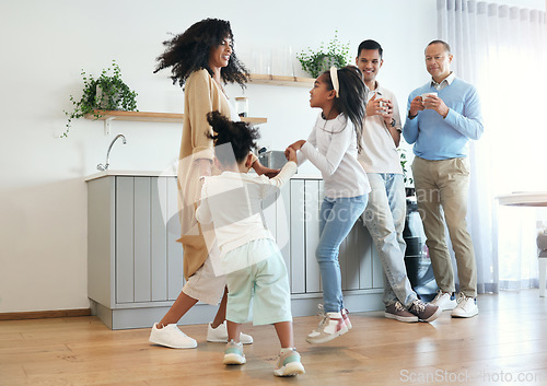 Image of Happy, dance and jump with big family in kitchen for bonding, weekend and celebration fun. Wellness, music and playing with children and mother for dancing for happiness, affection and holiday