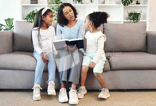 Image of Religion, book and children or family reading, teaching and learning bible story, knowledge and education in living room. Grandmother on sofa with holy scripture, gospel or history of god for kids