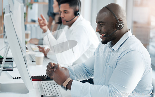 Image of Success, consulting and call center with black man at computer for deal, customer service and telemarketing. Happy, winner and target with consultant in office for technical support, sales and goals