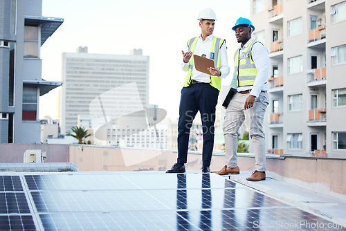 Image of Solar panels, rooftop and engineering people in energy saving, urban sustainability and city installation teamwork. Inspection, checklist and technician men planning sustainable power solution