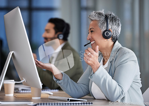 Image of Senior woman, call center and consulting in telemarketing, customer service or support at office desk. Happy elderly female consultant smile with headset for marketing, help or consultation advice