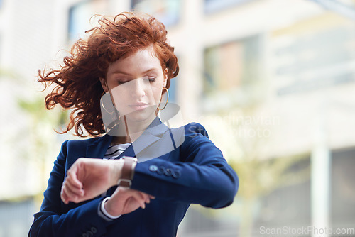 Image of Business woman, watch and checking time for schedule, planning or appointment in the city. Female employee looking at wristwatch in travel, commute or work opportunity in the street of a urban town