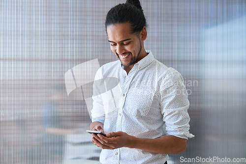 Image of Phone, business man and typing in office, social media or internet browsing online. Technology, cellphone and happy male entrepreneur with mobile smartphone for networking, texting or web scrolling.