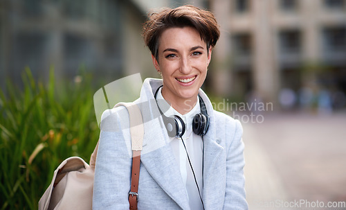 Image of Business woman, smile in portrait outdoor, young creative in city with success, happy and travel to work. Mockup, headshot and professional with headphones, content creator or web designer in Boston