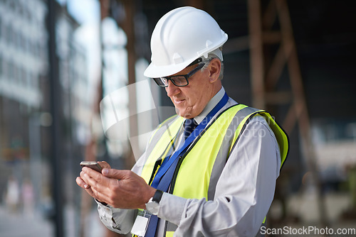 Image of Construction, engineer and man with phone for communication for building project management. Senior contractor person typing on smartphone for civil engineering contact, safety or development at site