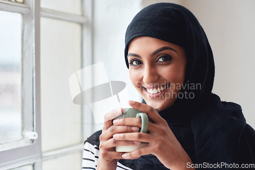 Image of Muslim business woman, portrait and coffee with smile, happiness or relax by office window for energy. Young islamic executive, hijab and happy for espresso drink, matcha or motivation for leadership