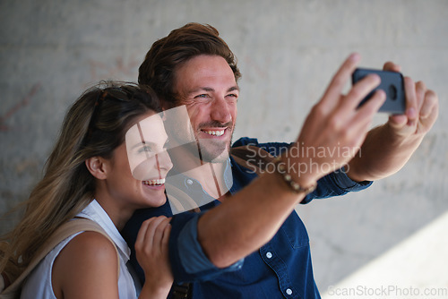 Image of Selfie, love and happy with a couple together, posing for a picture while on holiday or vacation. Photograph, travel or tourism with a man and woman posing while bonding outdoor in a foreign country