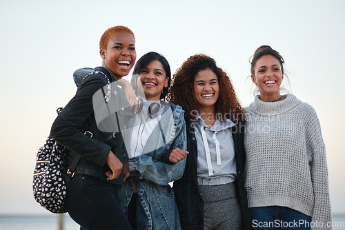 Image of Bonding, laughing and portrait of women at the beach for travel, quality time and a reunion. Smile, laughing and diversity with friends on a group vacation by the sea to relax together in Miami