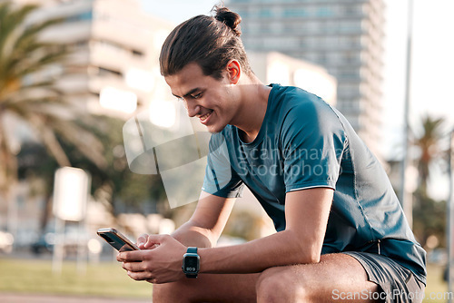 Image of Phone, fitness and man in city for workout, exercise and internet search on social media for health tips. Urban sports guy with smartphone, mobile typing and check wellness goals on digital tech app
