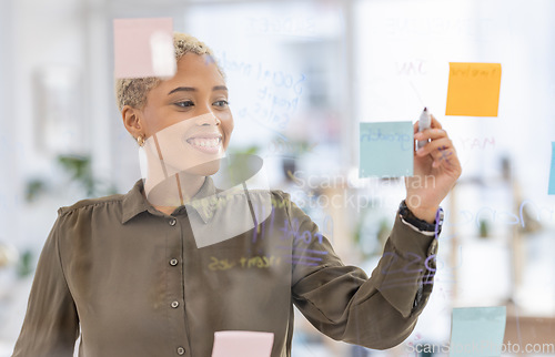 Image of Schedule, agenda and business woman writing, creative and planning sticky notes in office. Small business, startup and black female with idea, vision or career goal, development or marketing mission