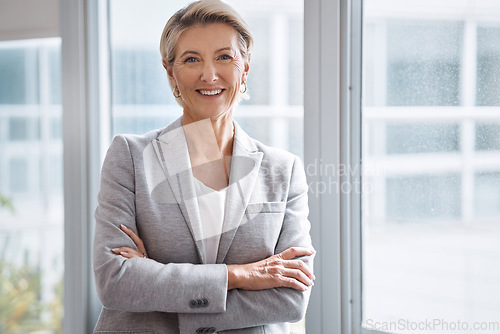 Image of Business woman, portrait or arms crossed by window in corporate financial, investment company or insurance office. Smile, happy or confident mature ceo in about us with success mindset for management