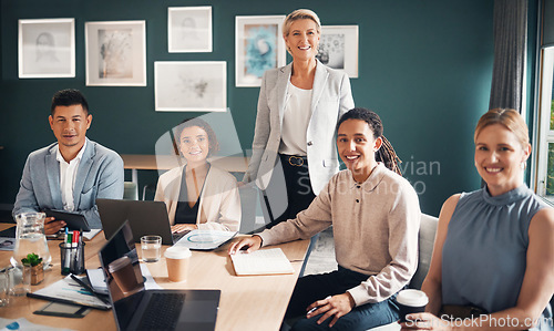 Image of Portrait, group of business people at desk with smile and confidence at meeting for employees in office. Teamwork, about us and leadership, senior lawyer with happy legal team at advisory law firm.