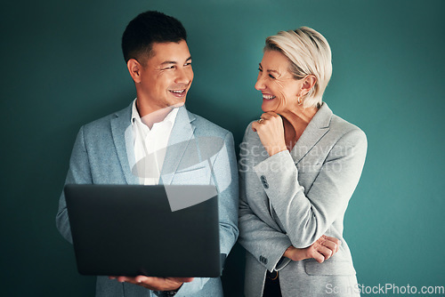 Image of Laptop, collaboration and planning with a business team in studio on a green background for strategy. Computer, teamwork or management with a man and woman working on growth as company leadership