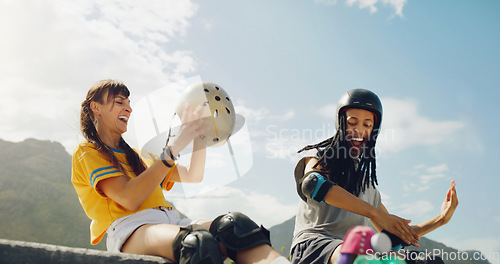 Image of Rollerskate, skatepark and fun with a couple of friends sitting outdoor on a ramp for recreation together. Fitness, diversity or sports with a man and woman bonding outside for an active hobby