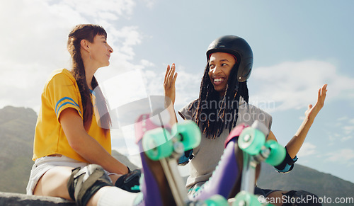 Image of Rollerskate, skatepark and sports with a couple of friends sitting outdoor on a ramp for recreation together. Fitness, diversity or fun with a man and woman bonding outside for an active hobby