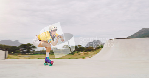 Image of Roller skate, extreme sports and woman riding fast with speed in a skate park with mockup space outdoors. Rollerskate, skater and female skating practicing or training with safety helmet