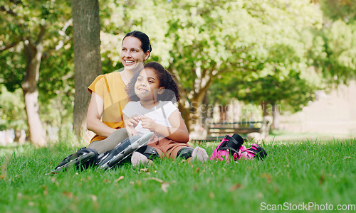 Image of Family, mother and kid in park with rollerblading outdoor, relax on grass and fun in nature with happy people. Woman, girl and taking a break, sports and quality time together with love and care