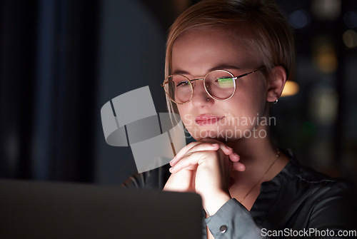 Image of Night, laptop and reflection with woman in office for overtime, planning and serious. Glasses, technology and internet with employee and deadline at desk for goals, management solution and email