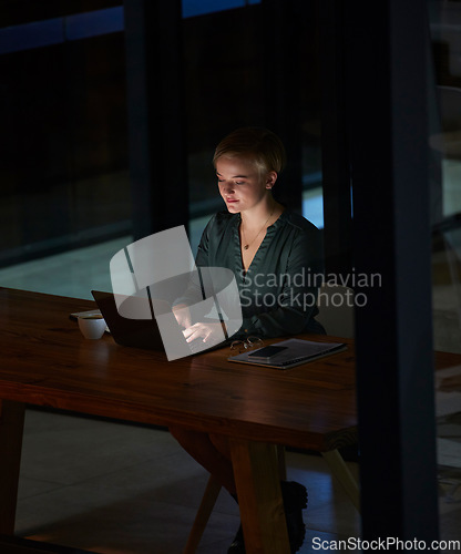 Image of Night, laptop and search with woman in office for planning, overtime and corporate strategy. Deadline, technology and email with employee typing proposal at desk for business, trading and internet