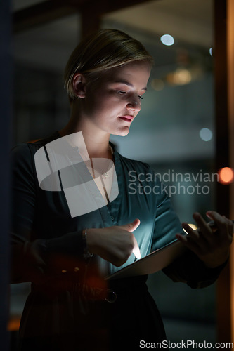 Image of Dark, tablet and woman is working overtime in late in the evening in a modern office for a startup company. Person, internet and female entrepreneur typing online in a blackout due to power cut
